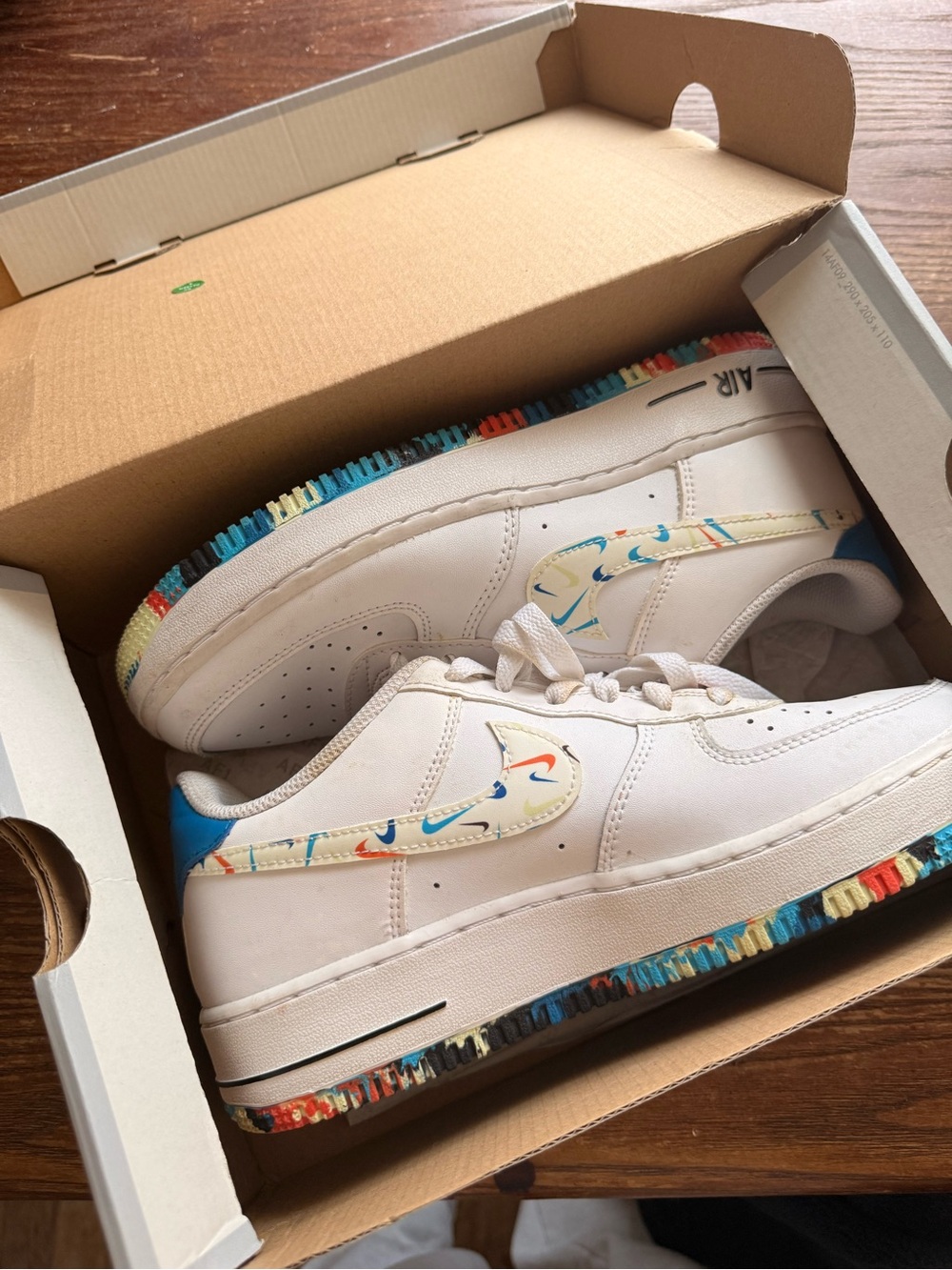 White Nike Low-Top Sneakers with Multicolor Accent